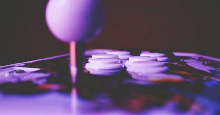 white joy stick and buttons on an arcade game at the Frisco Video Game Museum