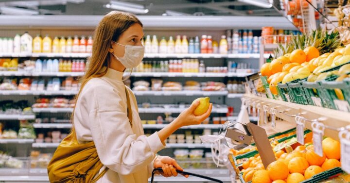 woman wearing mask grocery shopping