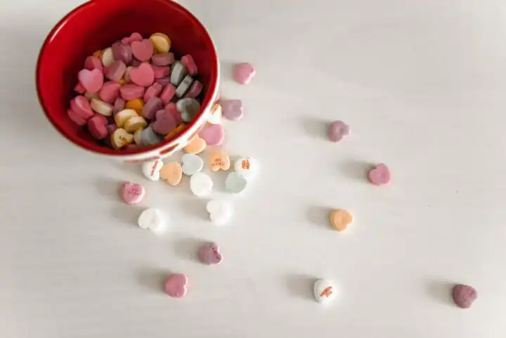 Sweetheart candy's in a bowl.