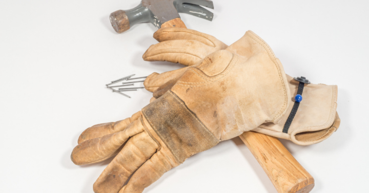 picture of gloves and hammer useful for home repairs