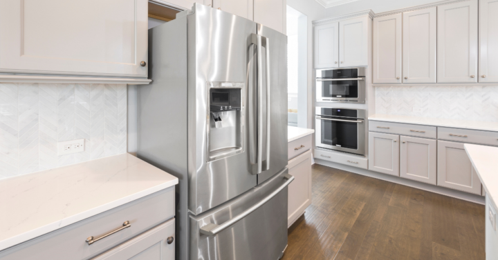 The photo shows a refrigerator in a modern kitchen