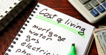 notepad with cost of living calculations