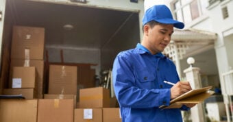 photo of a mover writing something down
