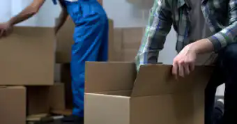 Photo of person packing a box