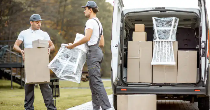 photo of movers moving a chair