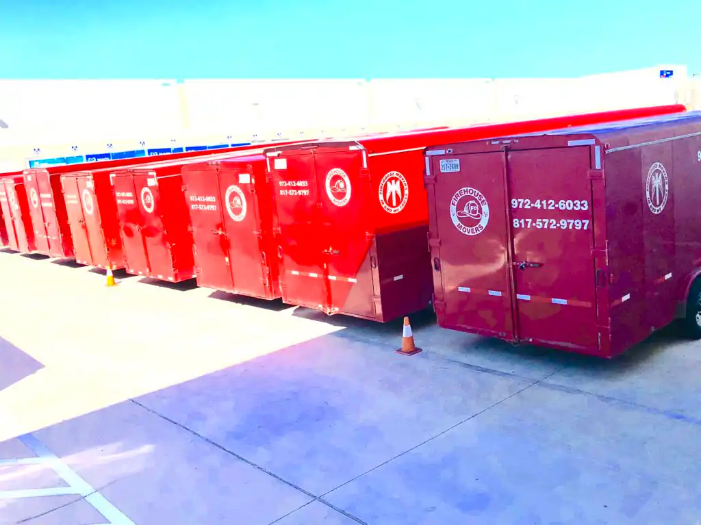 Photo of a row of FIrehouse Movers moving truck