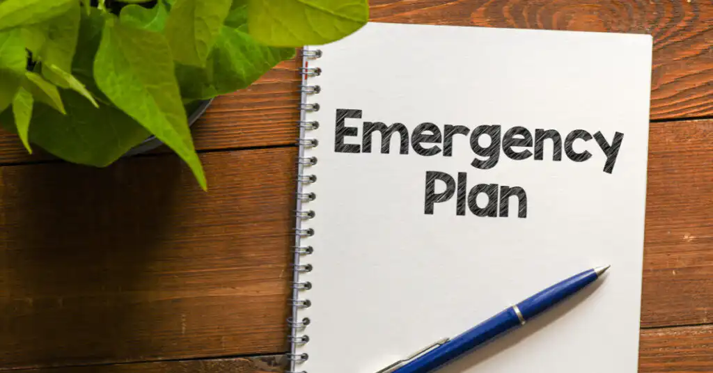 Emergency Plan written on a notebook