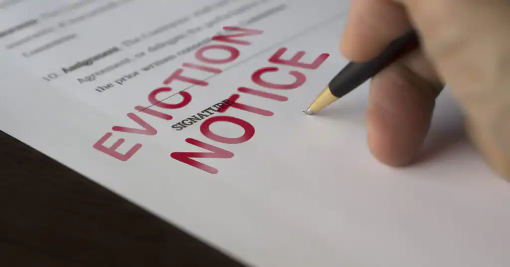 Someone signing an eviction notice