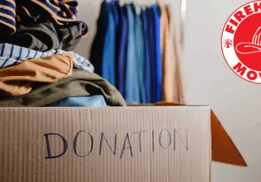a box of clothes in a donation box