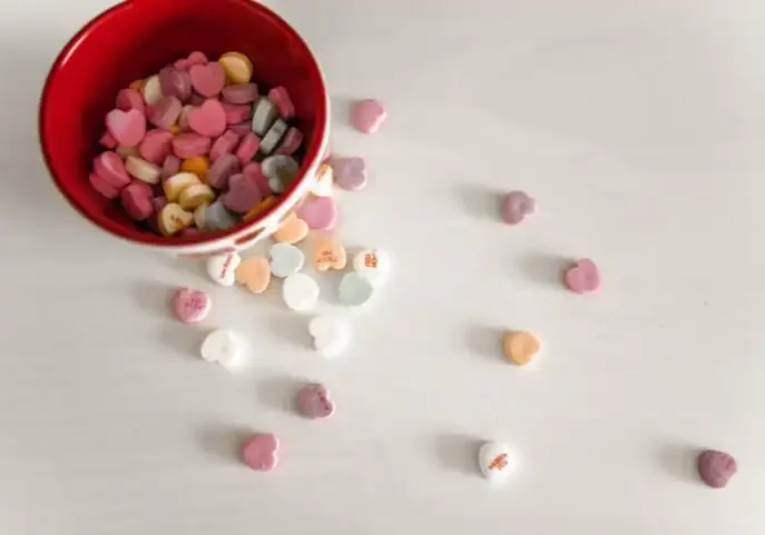 Sweetheart candy's in a bowl.