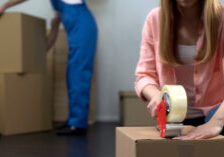 photo of someone taping a box