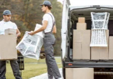 photo of movers moving a chair