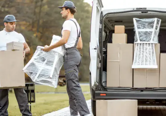 photo of movers moving a chair
