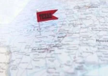 a map of the united states with a small flag that says Texas on the state of Texas.