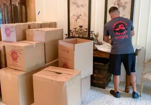 Stacks of packed moving boxes inside a new home, courtesy of Firehouse Movers.